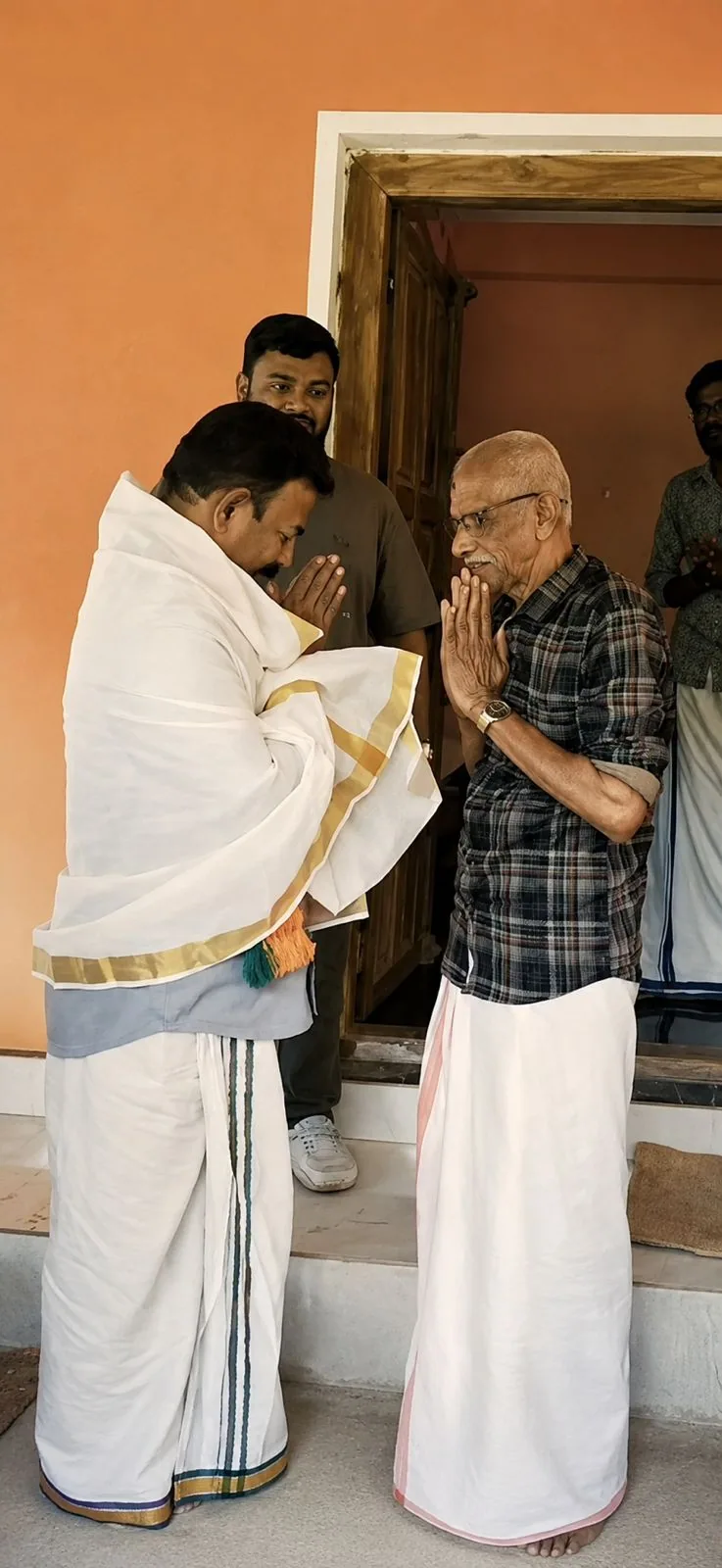 Major Ravi greeting an elder with folded hands