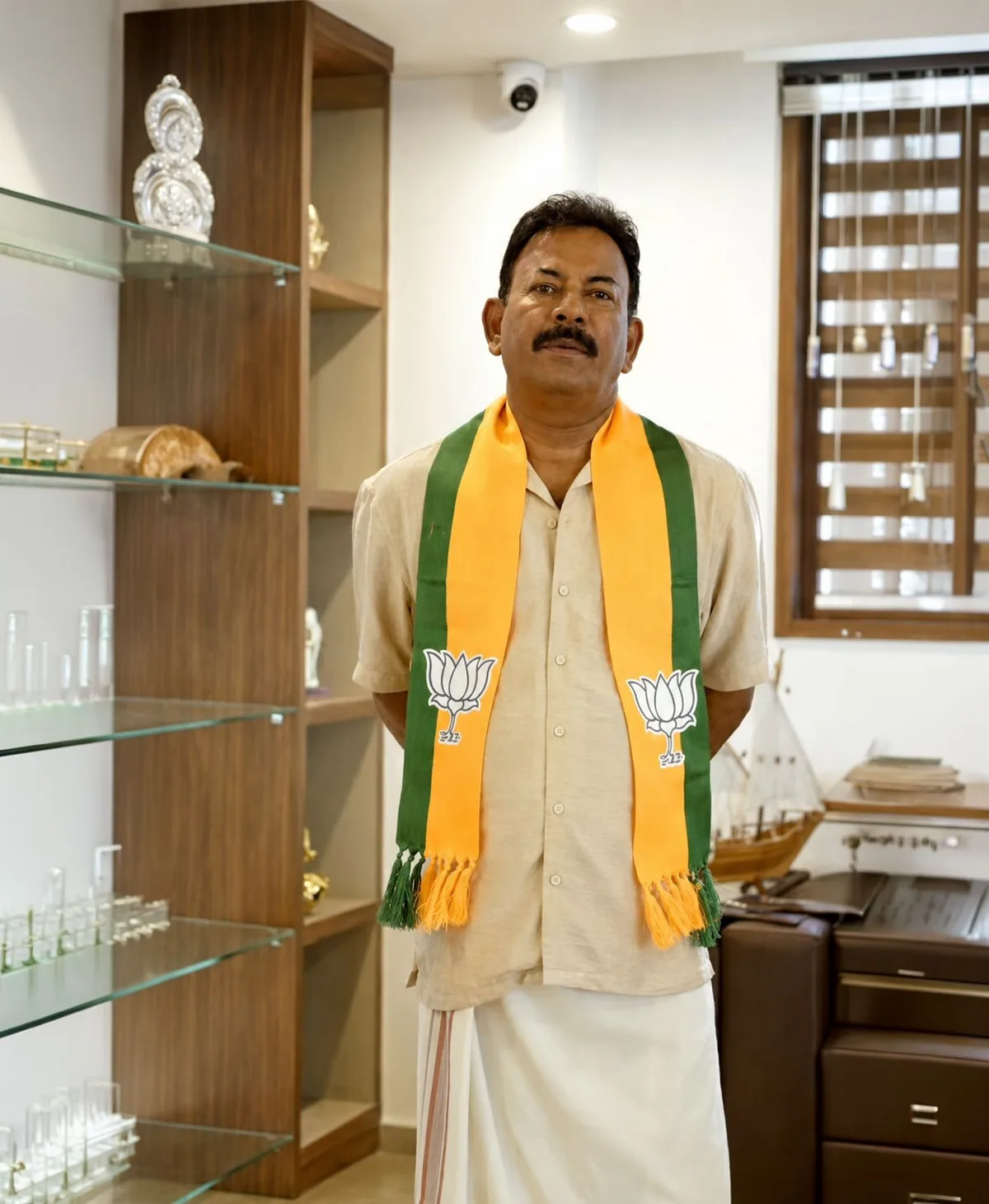 Major Ravi in Kerala attire with BJP scarf